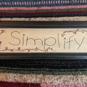 "Simplify Sticthed Sign, in a Black Wooden Frame